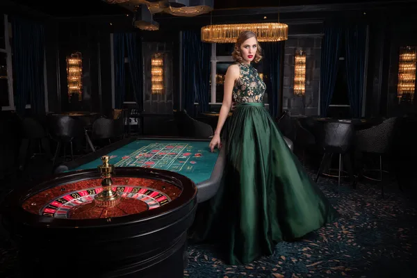 CROWNBD Mobile Casino — Play anytime, anywhere A player using their smartphone during a festive local event, representing CROWNBD’s fully mobile-friendly casino.